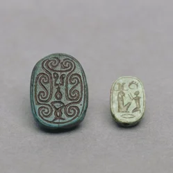 Egyptian faience scarab amulet, Second Intermediate Period; green feldspar scarab amulet, Late Period